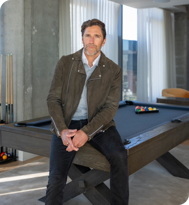 NHL Hall-­of-­Famer Henrik Lundqvist sitting.